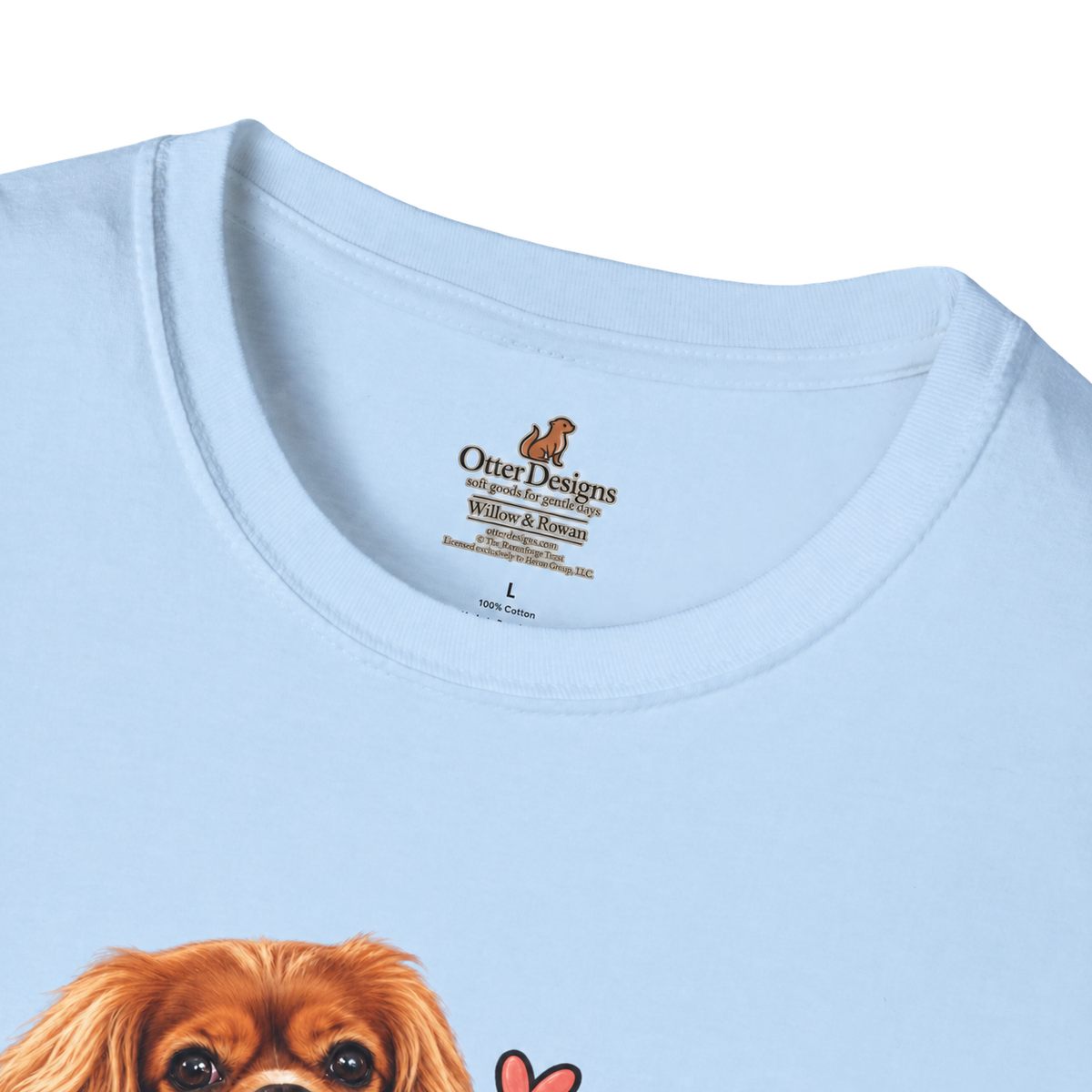 Close-up of the light blue T-shirt neckline with the Otter Designs Willow & Rowan printed inner label.